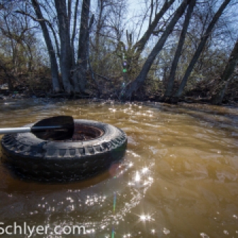 A tire being collected out of the Anacostia River for Earth Day clean-up 2014.
