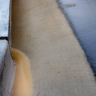 Silted stormwater runoff going into storm drain in Mount Rainier, MD.